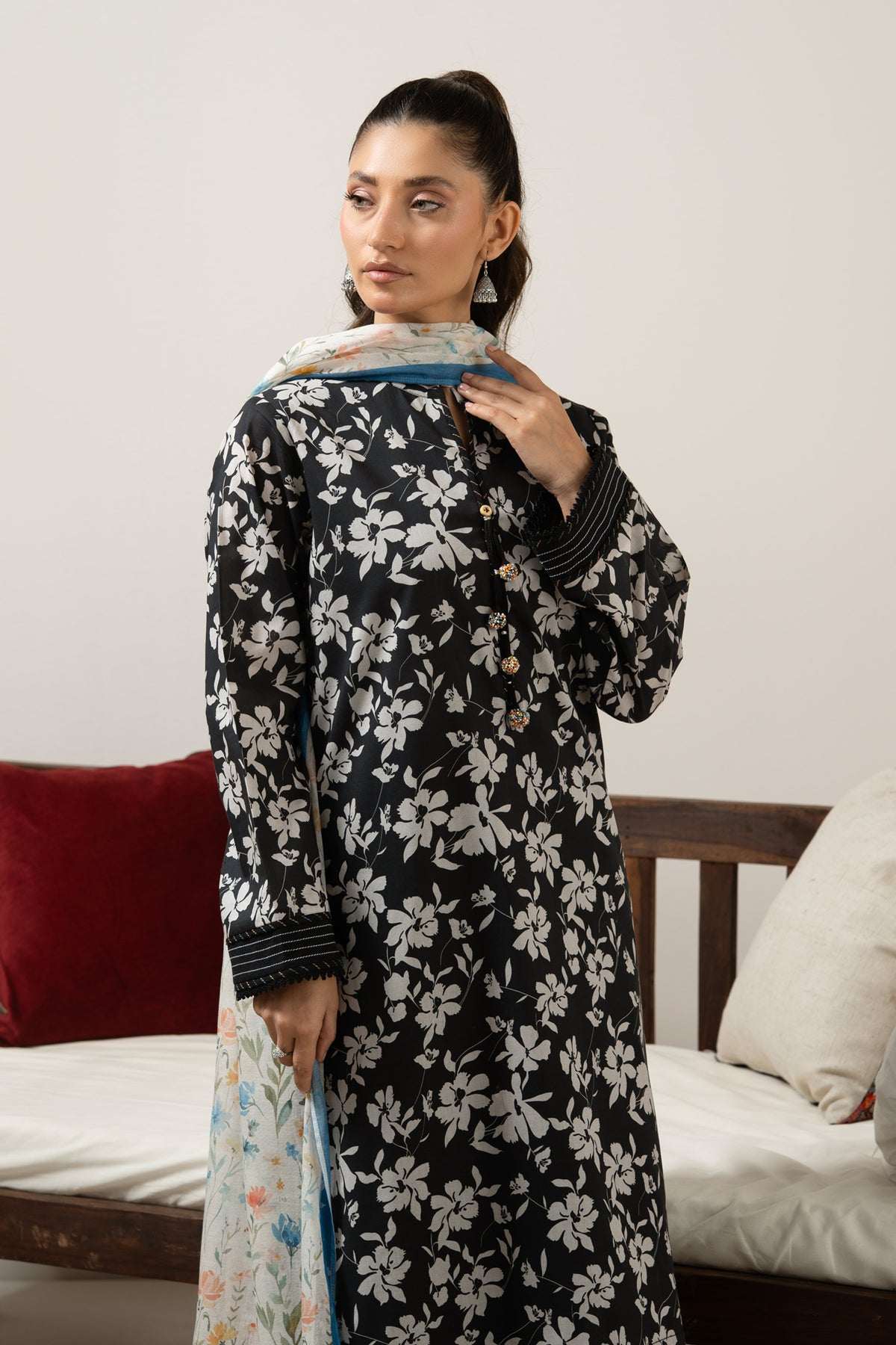 Luxury black unstitched 3-piece printed lawn dress material featuring detailed ethnic print layout lines